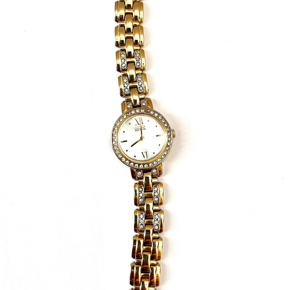 Elegant ladies gold watch adorned with diamonds